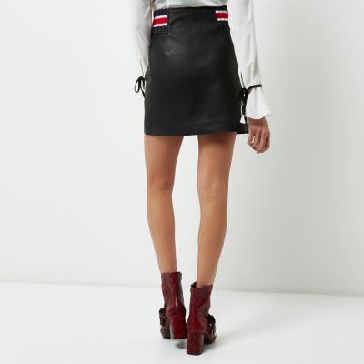 Black faux leather embroidered zip mini skirt
